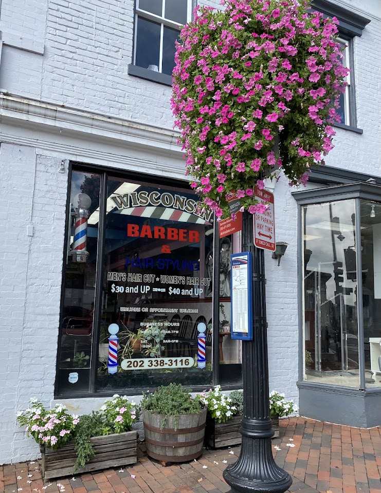 Wisconsin Barber & Hair Styling storefront with barber poles on Wisconsin Avenue, Georgetown